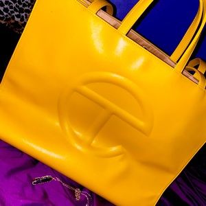Large Sized Authentic Telfar Bag. The color is a warm golden yellow: